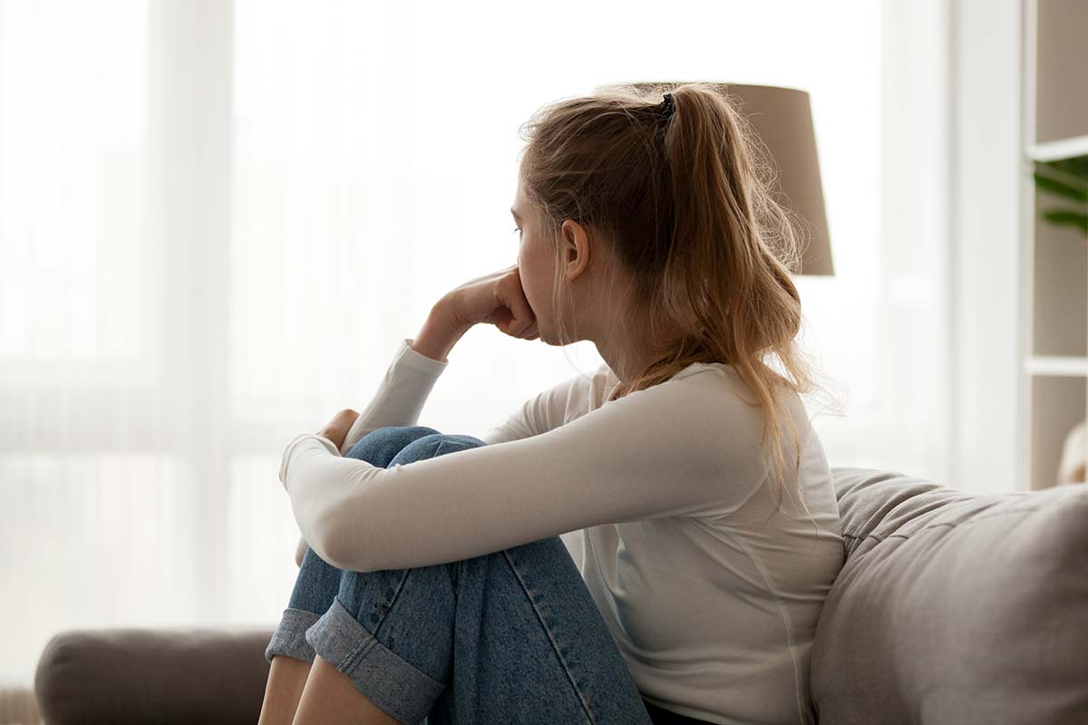 Teenager looking out of the window